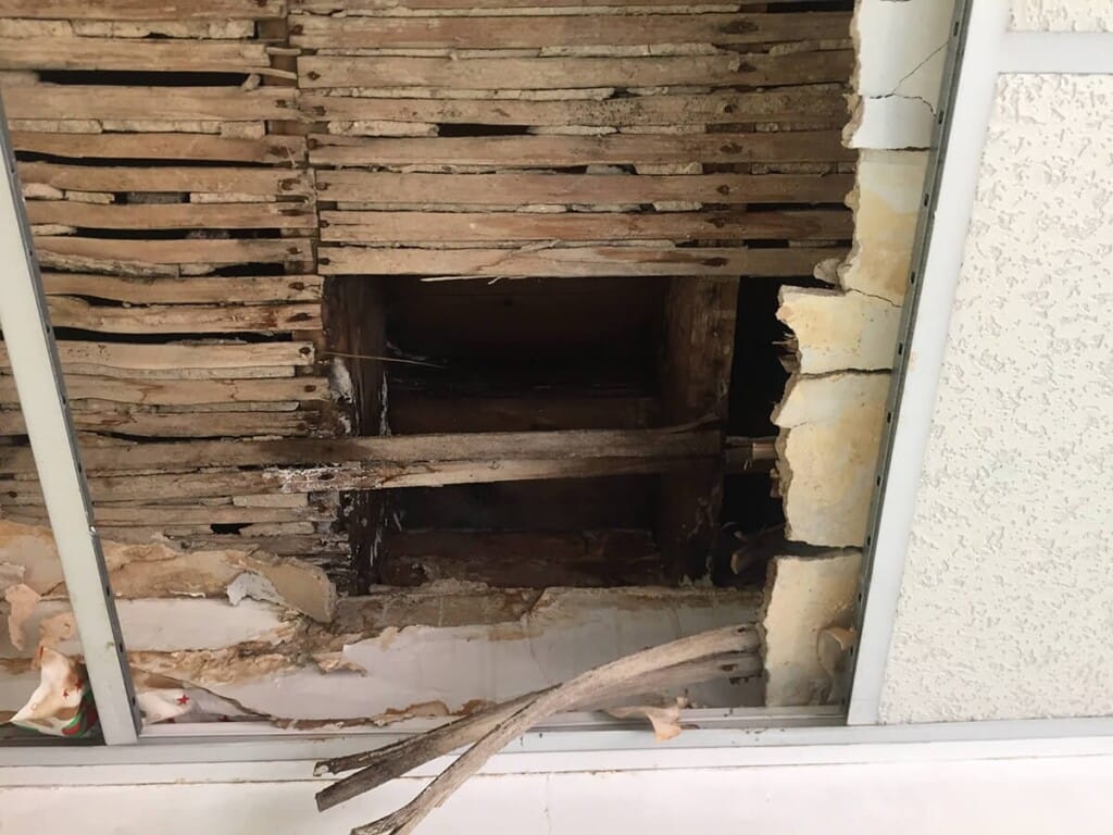 Damaged Ceiling Beneath a Flat Roof